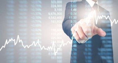 Bir ekrandaki resimli grafikler borsa finansal verileri analiz ediliyor