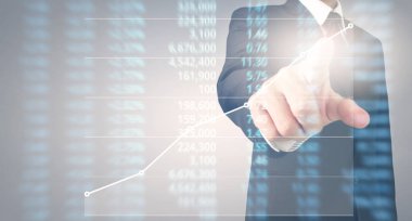 Bir ekrandaki resimli grafikler borsa finansal verileri analiz ediliyor