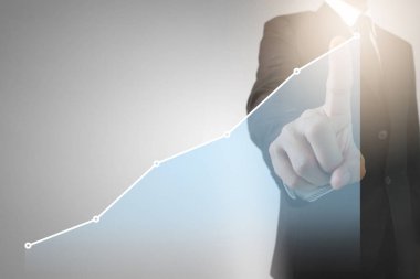 Bir ekrandaki resimli grafikler borsa finansal verileri analiz ediliyor