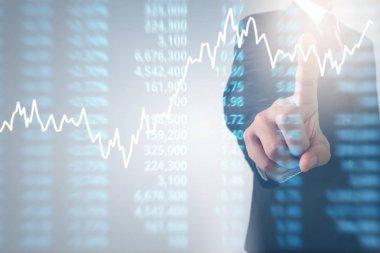 Bir ekrandaki resimli grafikler borsa finansal verileri analiz ediliyor