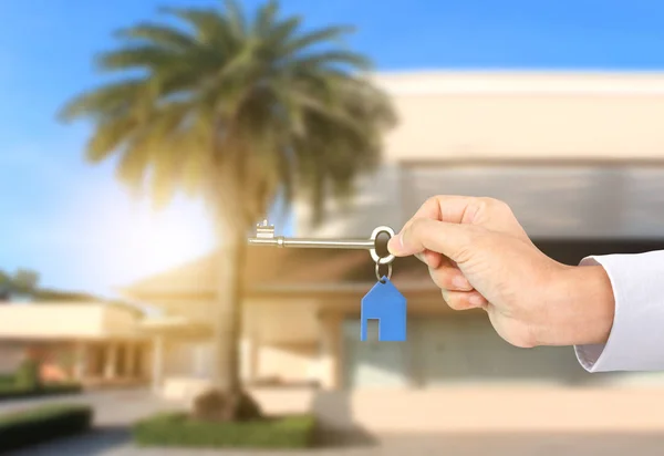 Investment concept ,House key in hand