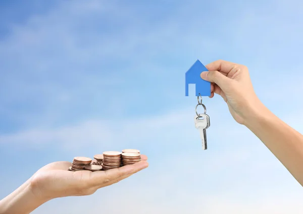 Investment concept ,House key in hand