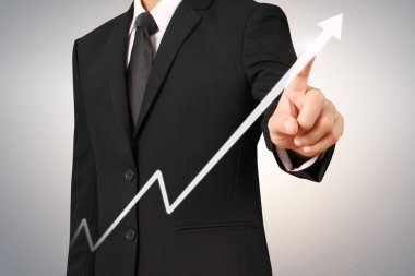 Elden gelen finansal sembollere sahip iş adamı, dokunma grafiği