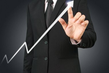 Elden gelen finansal sembollere sahip iş adamı, dokunma grafiği
