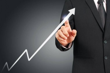 Elden gelen finansal sembollere sahip iş adamı, dokunma grafiği