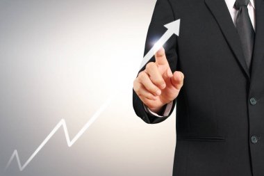 Elden gelen finansal sembollere sahip iş adamı, dokunma grafiği