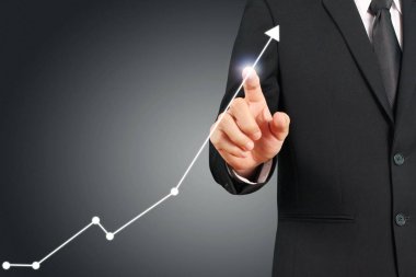 Elden gelen finansal sembollere sahip iş adamı, dokunma grafiği