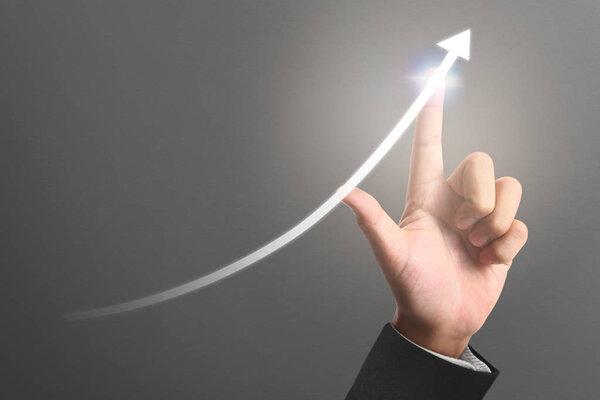 Businessman plan graph growth and increase of chart positive indicators in his business