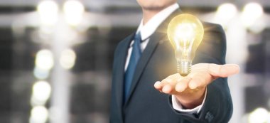 Aydınlatılmış ampulün, yenilikçi ilhamın eli.