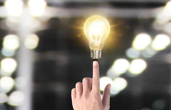 Hand of holding illuminated light bulb, idea, innovation inspira — ストック写真