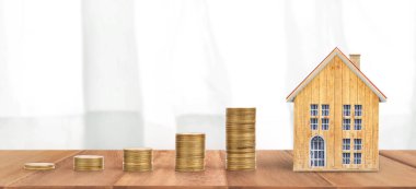 Ev modeli ve madeni paralar. Konut ve Emlak kavramı. ev işi fikri