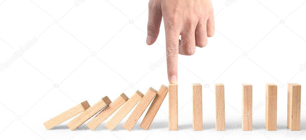Hand stopping the Domino effect stopped by unique, Business Ideas
