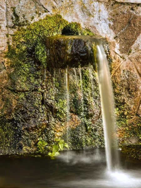 Ancient stone water drinking fountain in Corsica — Stock Photo, Image