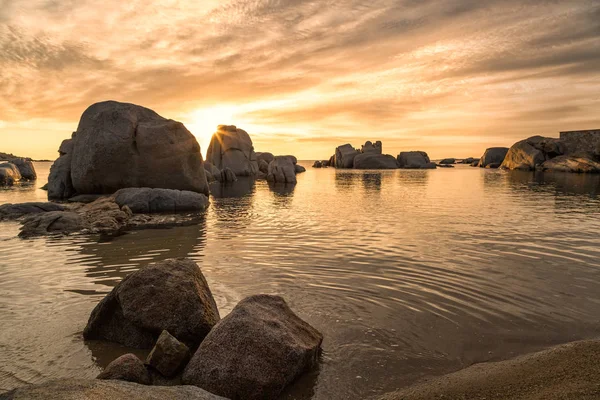 Sunrise over boulders on Cavallo Island south of Corsica — Stock Photo, Image