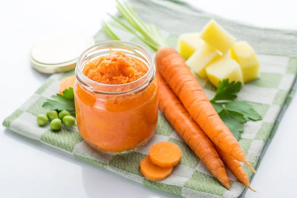 Carrot homemade baby food in a glass jar — Stock Photo, Image