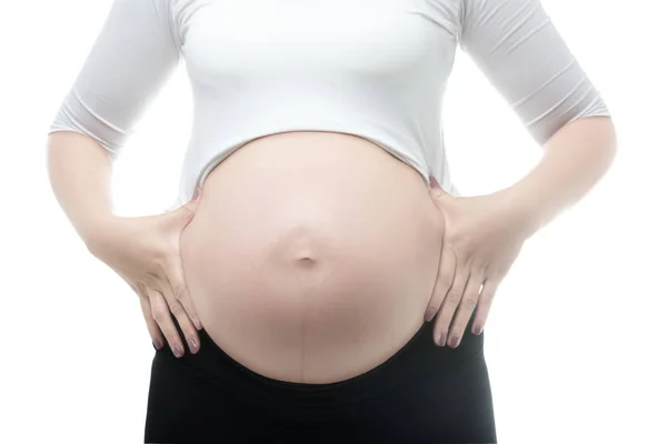 Mulher grávida tocando sua barriga grande. — Fotografia de Stock