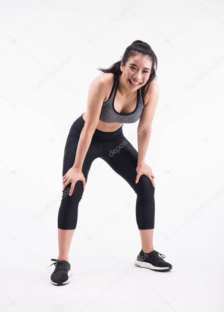 tired young fitness woman after Squat exercise 