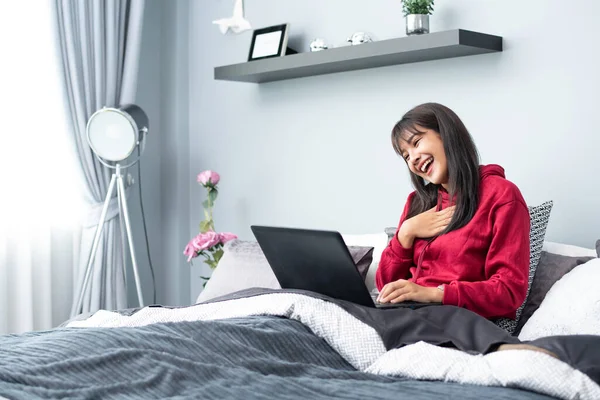 Young Asian Woman Works Home Tablet Computer Enjoys Morning Weekend Stock Photo