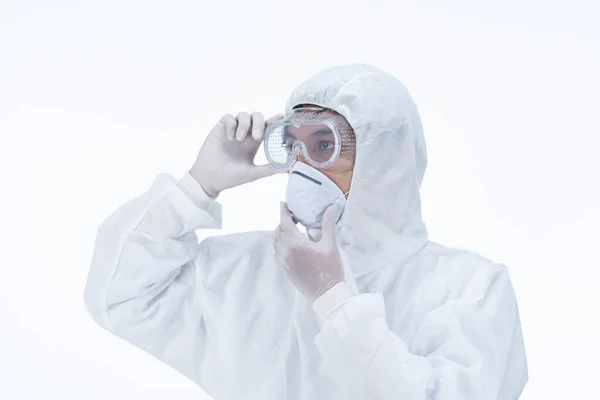 a doctor wearing protective suit to fight coronavirus pandemic covid-2019 on white background.