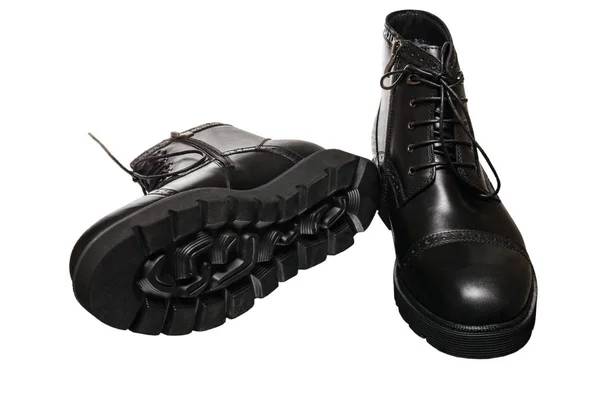 High black winter boots with lacing and lock on the thick sole, of leather and fur — Stock Photo, Image