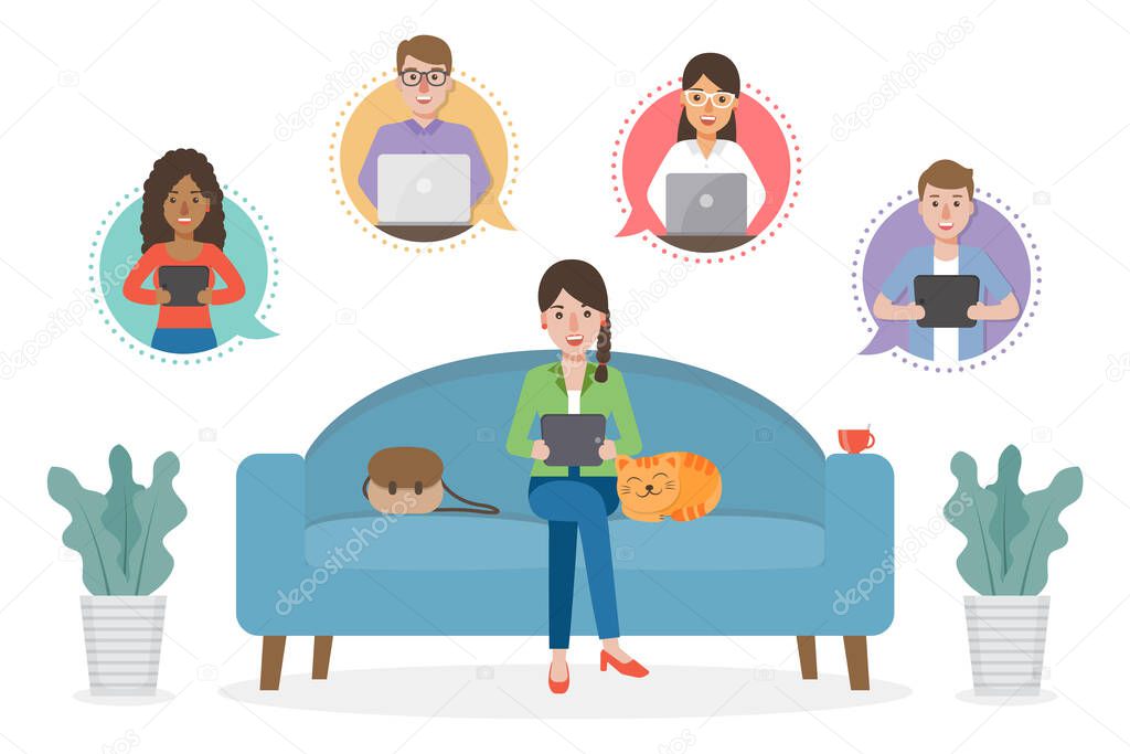 A woman working from home during Covid-19 pandemic by sitting with a cat on sofa at living room doing teleconference with colleagues. Work from home concept.