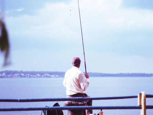 the old man watch the blue sea during the fishing
