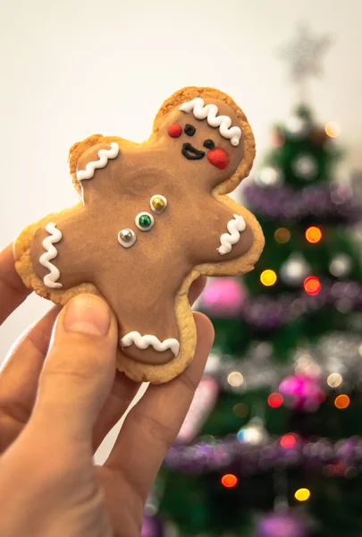 Close Hand Holding Homemade Christmas Cookie Blurred Christmas Tree Lights — Stock Photo, Image