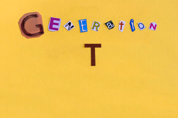 Word "Generation T" formed with cut letters. The new generation of technology after Millennial also called Alpha Generation or Children of Millennials.