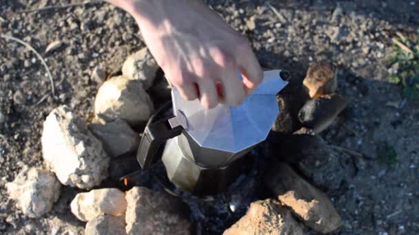 Young Man Preparing Coffee Bonfire Pouring Cup Natural Place Hiker — Stock Video