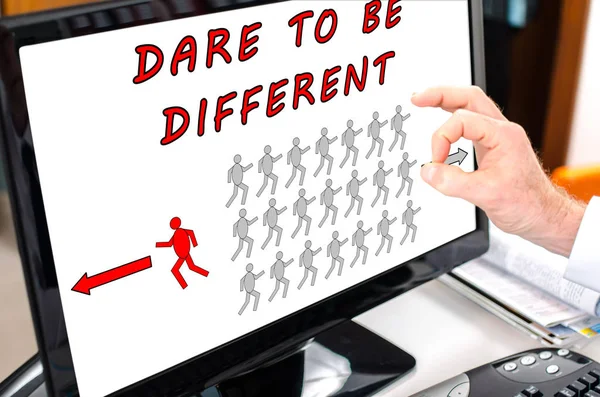 Dare to be different concept on a computer monitor