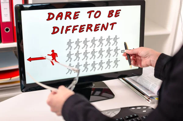 Dare to be different concept on a computer monitor