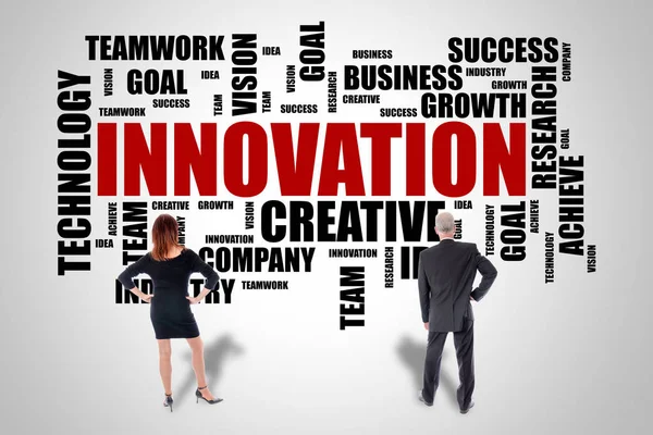 Innovation word cloud concept watched by business people — Stock Photo, Image