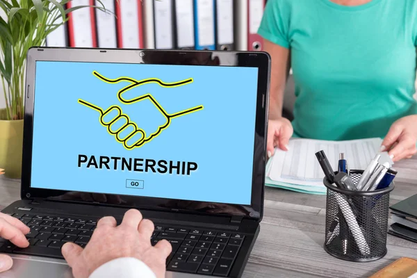 Partnership concept on a laptop — Stock Photo, Image