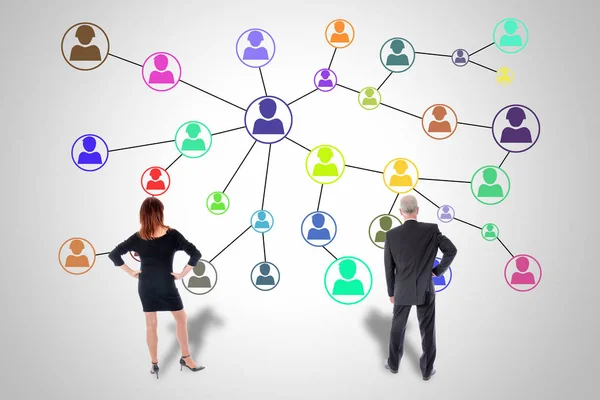 Social network concept watched by business people — Stock Photo, Image