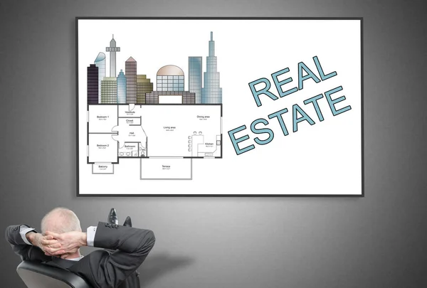 Businessman looking at real estate concept — Stock Photo, Image