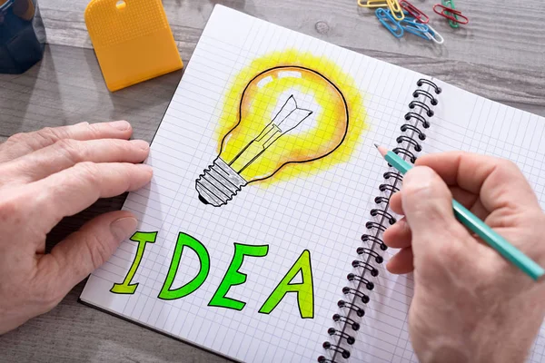 Idea concept on a notepad — Stock Photo, Image