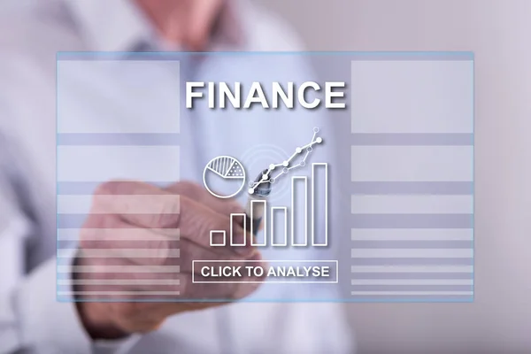Homem tocando um conceito de finanças em uma tela sensível ao toque — Fotografia de Stock