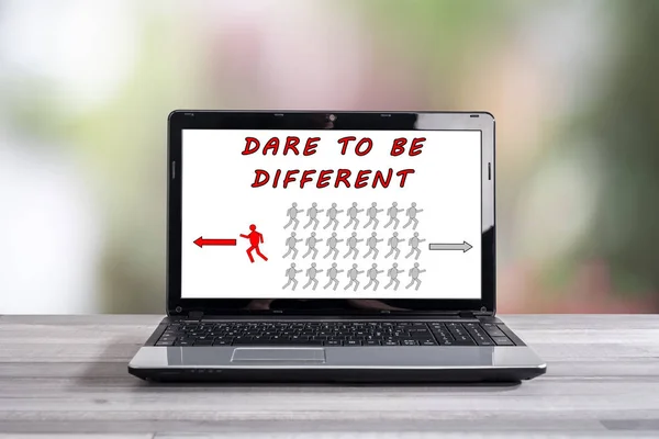 Dare to be different concept on a laptop screen
