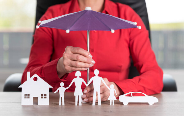 Concept of insured house, family and car