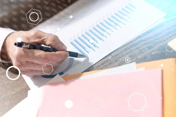 Man working on financial graphs, double exposure, light effect — Stock Photo, Image