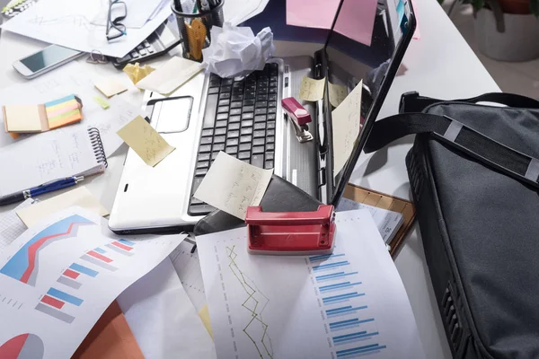 Messy and cluttered desk