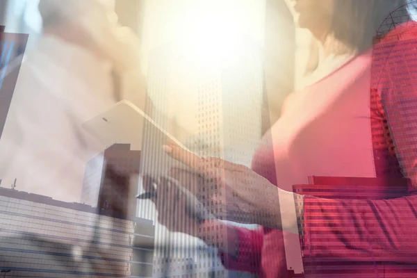 Businesswoman working on tablet, double exposure, light effect — Stock Photo, Image