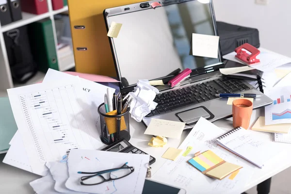 Messy and cluttered desk