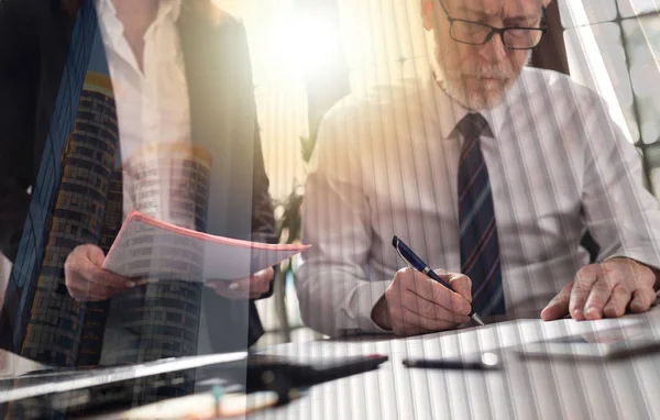 Senior manager working with executive assistant, double exposure — Stock Photo, Image