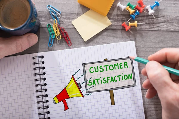 Customer satisfaction concept on a notepad — Stock Photo, Image