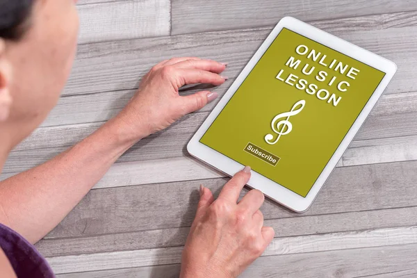 Online music lesson concept on a tablet