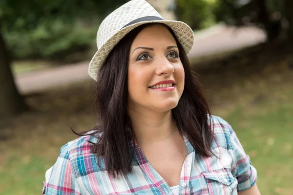 Portrait of happy young woman in a park Royalty Free Stock Images