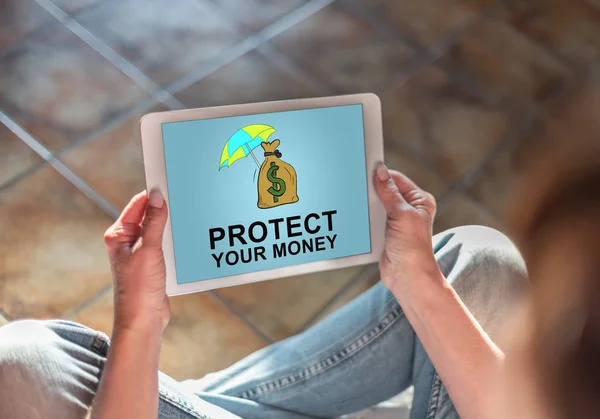 Money protection concept on a tablet