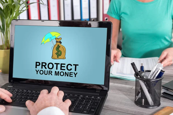 Money protection concept on a laptop