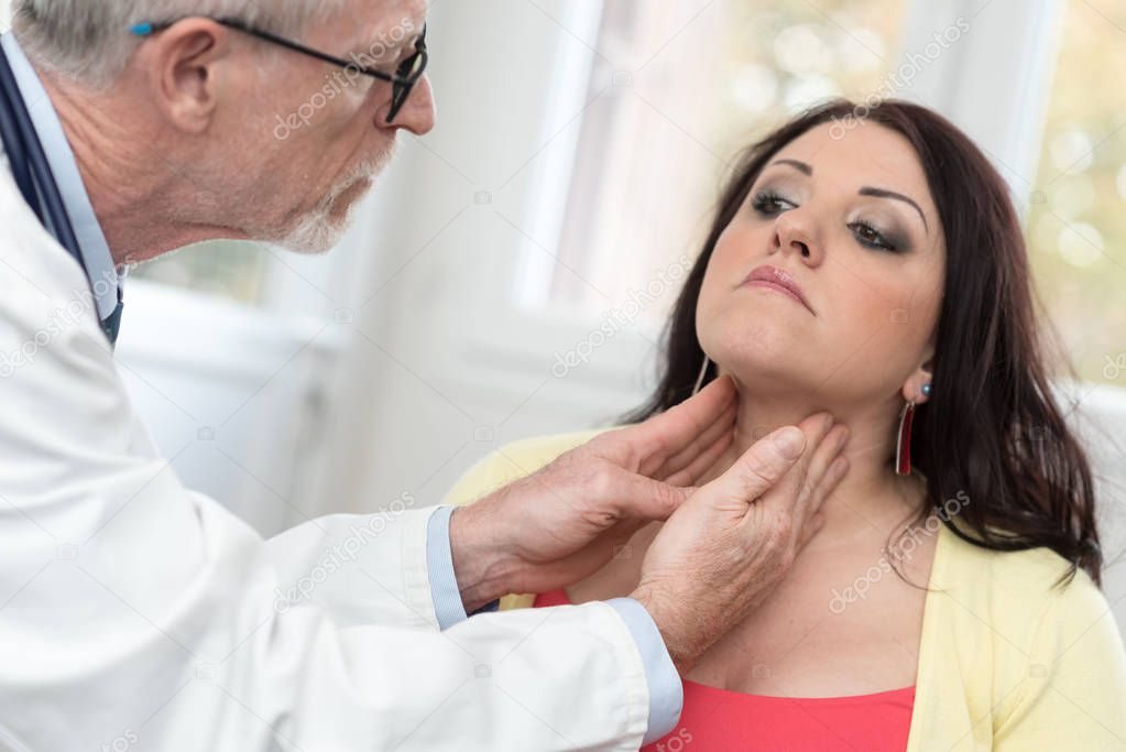 Doctor checking thyroid
